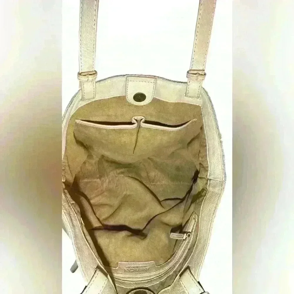 An American Leather Co. nude/cream colored leather woven tote bag.